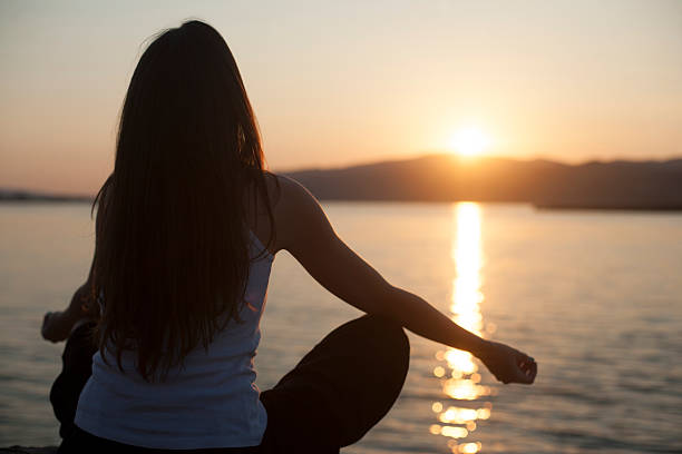 istock Relaxation on the water outdoors, woman with hands up 477463386