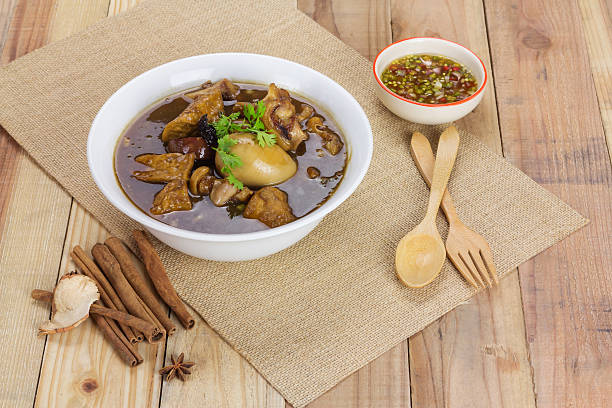 istock Pork and egg stewed in the gravy on wooden table 477463982