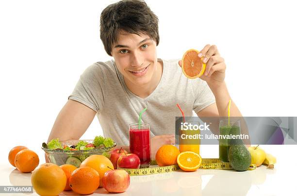 Man Having A Table Full Of Fruit Juices And Smoothie Stock Photo - Download Image Now