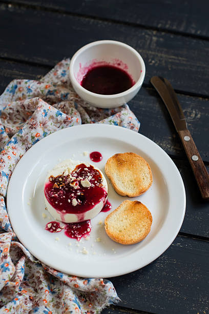 istock goat cheese with berry sauce and walnuts 477465490
