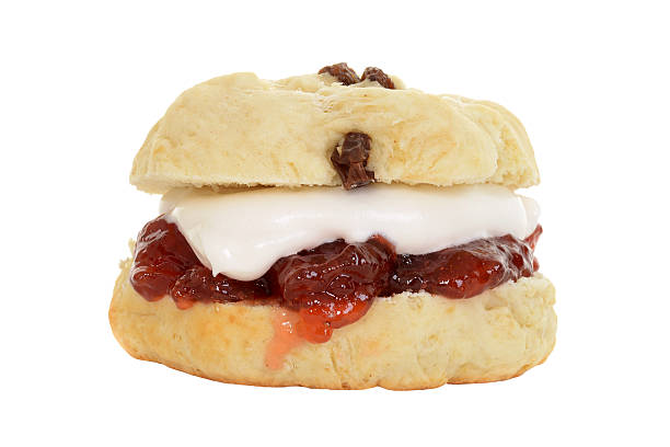 istock isolated english scone with cream and jam 477465516