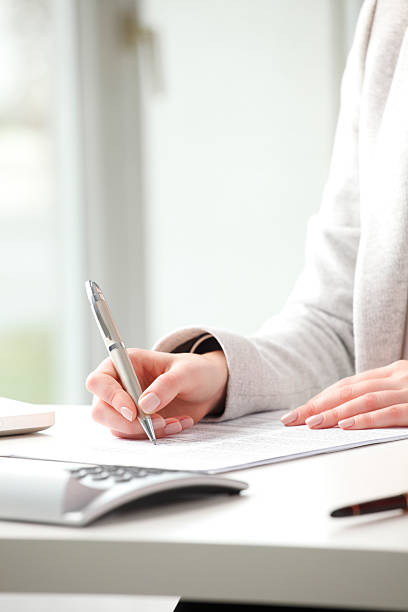 istock Businesswoman fill the form 477466227