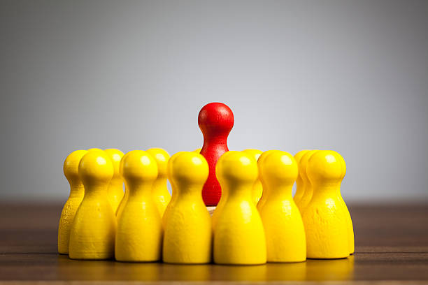 istock Rising above the rest concept with toy pawn figures 477469017