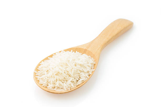 istock jasmine rice on Wood Ladle 477469294