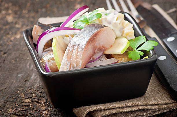 istock Herring salad with onion and green apple 477470355