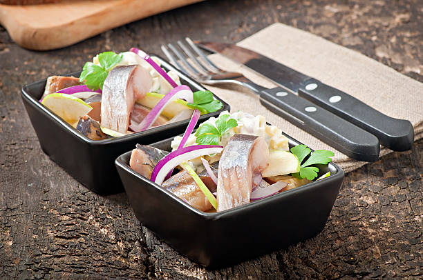 istock Herring salad with onion and green apple 477470361