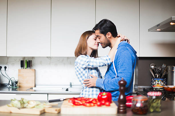 istock romantic moment while cooking together at home. 477474430