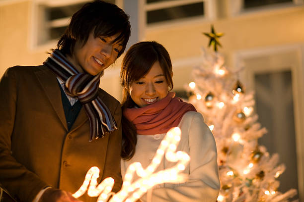 Couple looking at illumination of Christmas stock photo