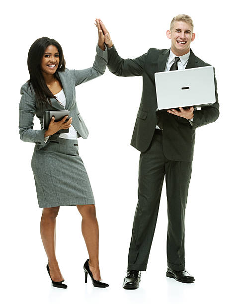 istock Smiling business couple giving high five 477476524
