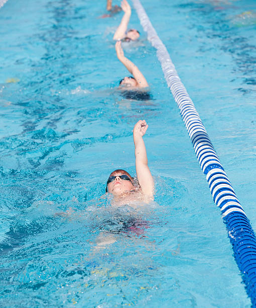 istock Young Teenage Boy Swimming Backstroke 477479866