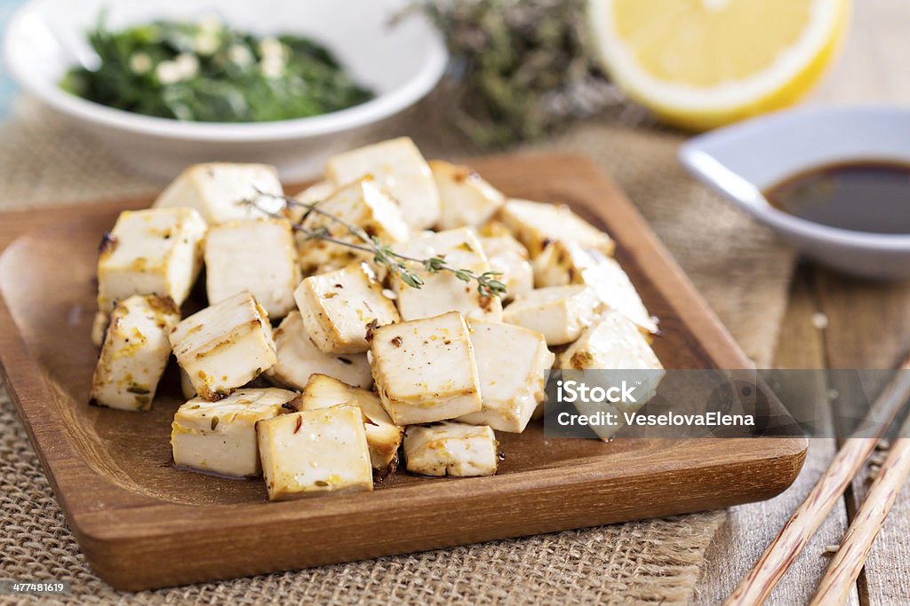 Baked tofu with spices Baked marinated tofu with herbs and spices Tofu Stock Photo