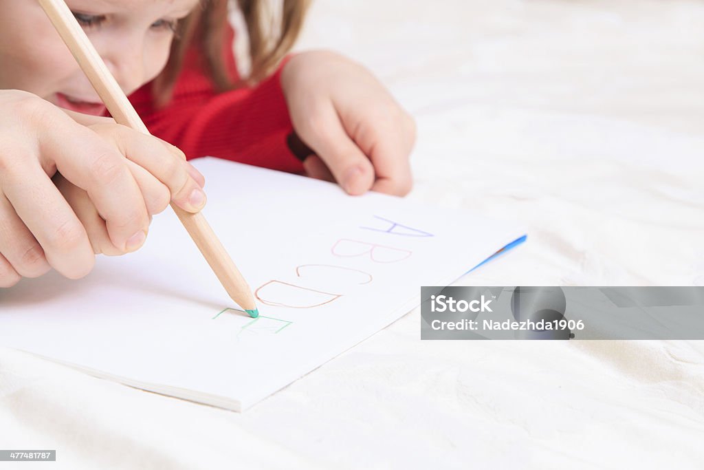 hands of mother and child writing letters hands of mother and child writing letters, early education Activity Stock Photo