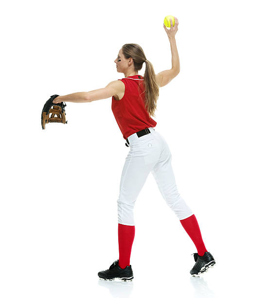 istock Female softball player throwing a ball 477481804