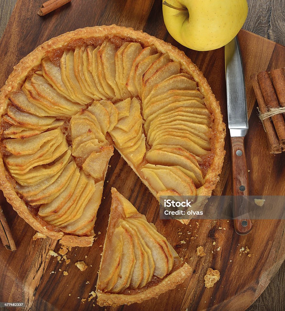 French apple tart French apple tart on a brown background Apple - Fruit Stock Photo