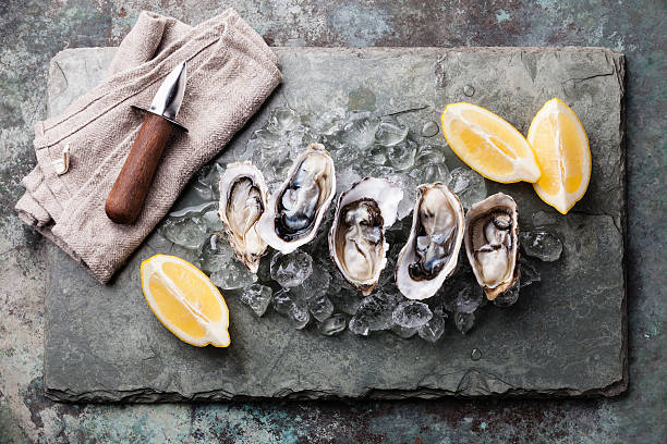 istock Oysters with ice and lemon 477482460