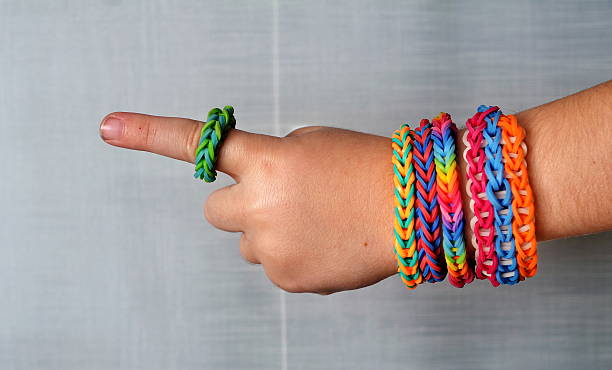 istock Little boy with loom band bracelets 477483675