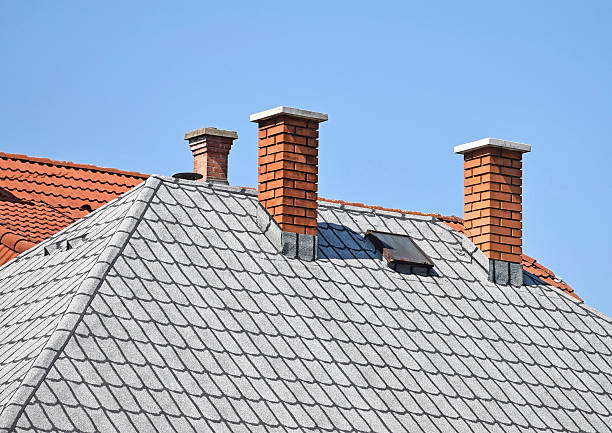 istock House roof with smoke stacks 477485070