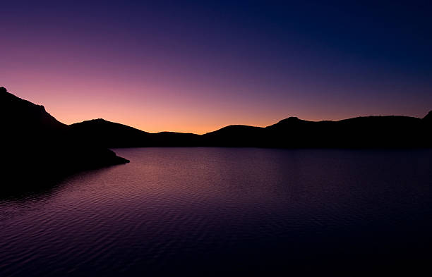 istock sunrise over the mountain lake 477485524
