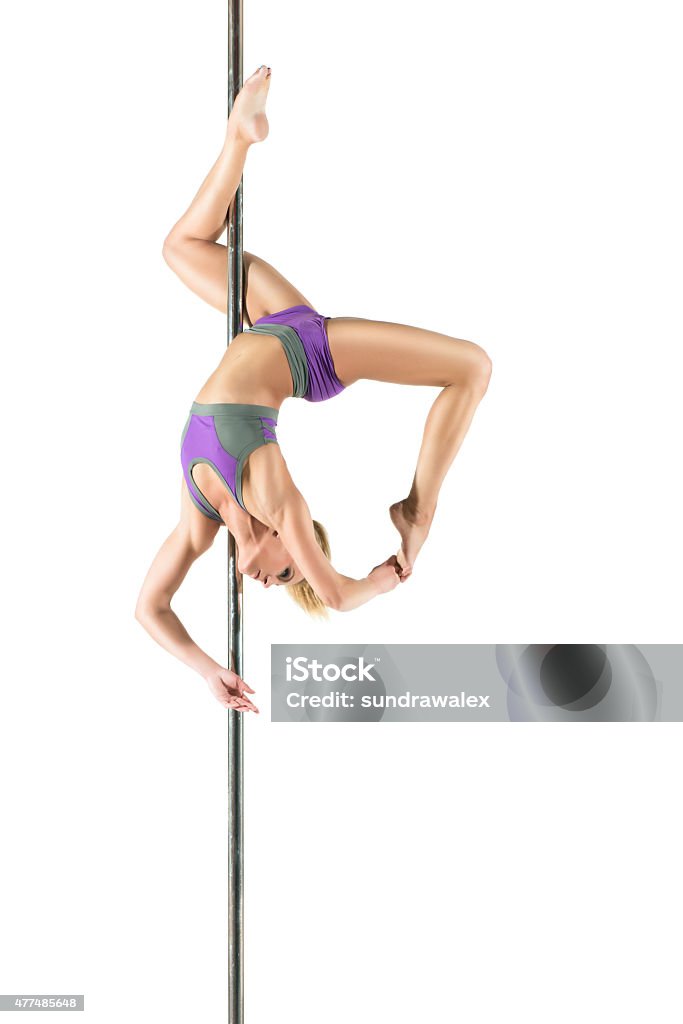 Female Pole dancer Female Pole dancer, woman dancing on pylon isolated on white background 2015 Stock Photo