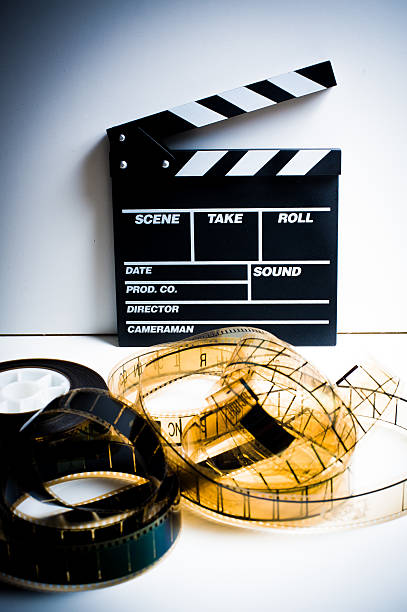 istock Movie clapper with 35 mm film on white 477489132