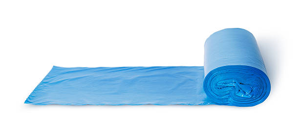 istock Roll of blue plastic garbage bags in front view 477491940