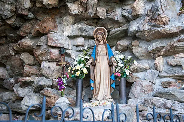 The statue of the Virgin Mary in a stone cave