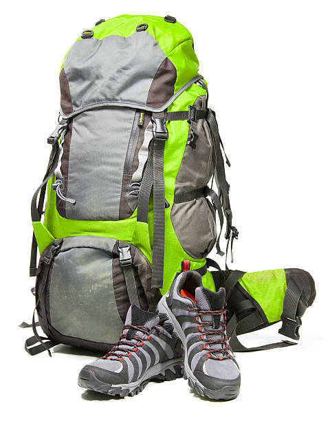 istock Hiking shoes and packed backpack on white background 477497492