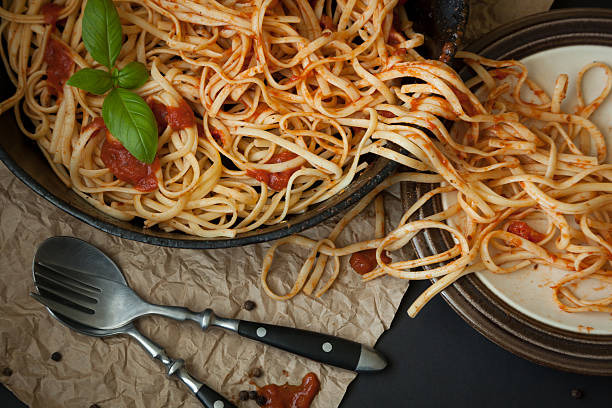 istock Linguine with Basil and Red Sauce in Cast Iron Pan 477497866