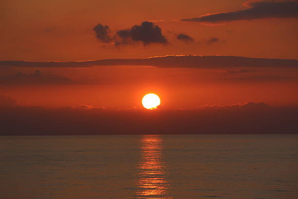 istock Stunning red sunset over ocean in Hawaii 477498667