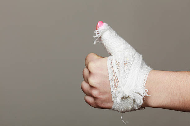 istock Hand tied elastic bandage on gray background 477504200