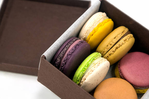 istock Colorful Macaron in paper box on white background 477504731