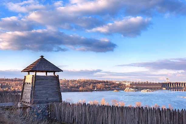 istock Old wooden fence against blue sky with clouds. Background 477514160