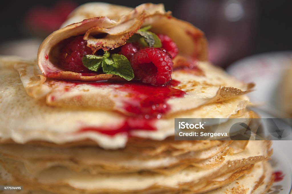 pancakes with raspberries pancakes with raspberries on a black table Berry Fruit Stock Photo