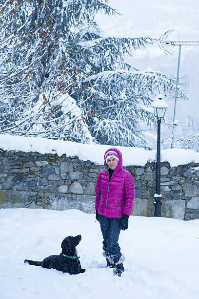 istock Woman playing in the snow 477516245