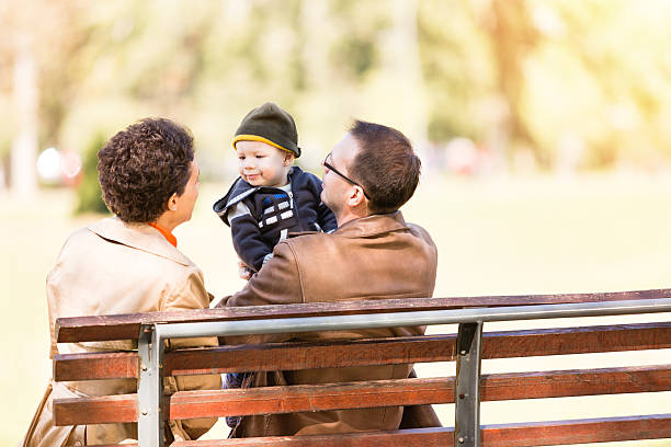 istock Parents and baby boy in the park 477516346