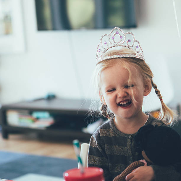 istock Happy toddler with a tiara and a silly face 477516638