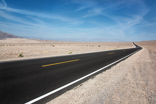 A newly paved road through the desert of Death Valley National Park, California.