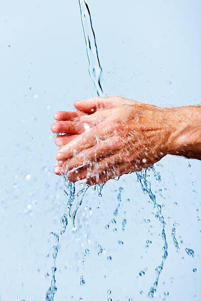 istock Man washing hands under running water: good hygienic behavior 477517905