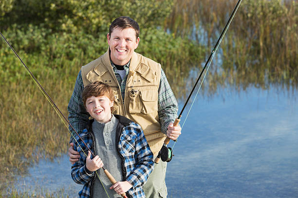 istock Father and son fishing 477518049