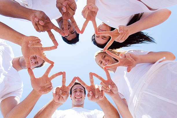 istock group of people hands forming a star shape 477518849