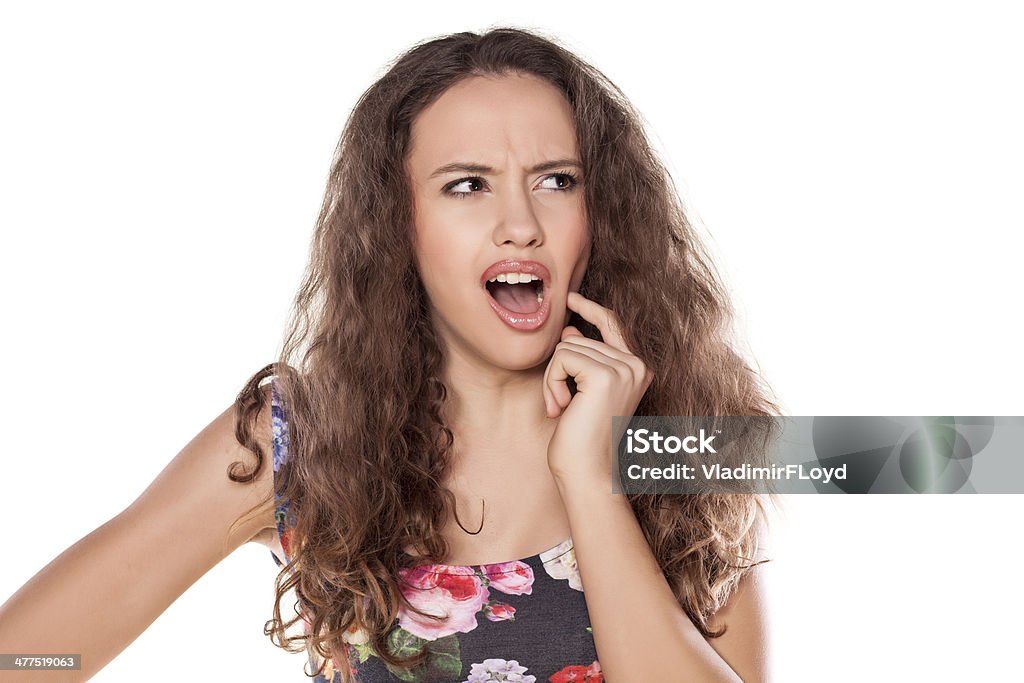 tootache young beautiful girl has a toothache Women Stock Photo