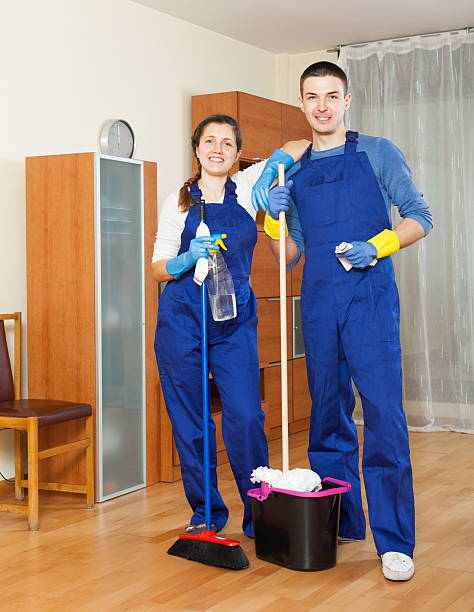 istock Two handsome cleaners cleaning floor 477522773