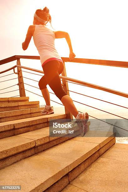 Healthy Lifestyle Asian Woman Running At Stone Stairs Seaside Stock Photo - Download Image Now
