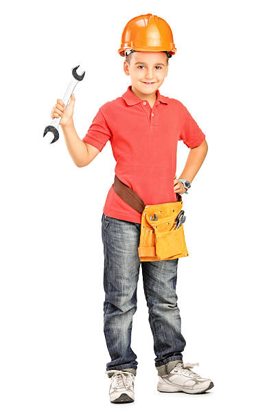 istock Boy with helmet holding a wrench 477523331