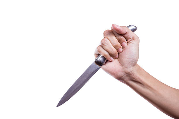 istock hand holding the knife isolation on white background 477524306
