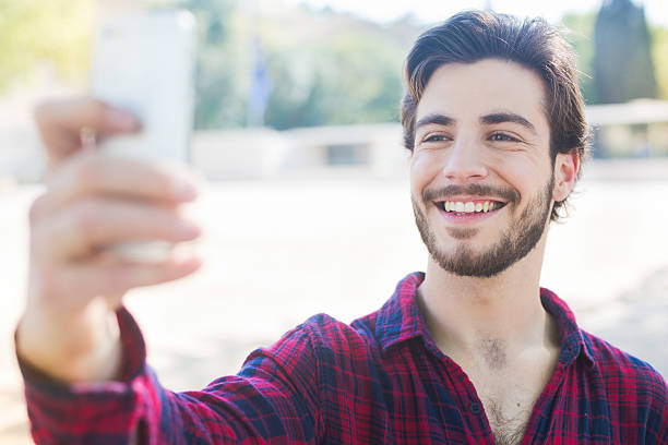 istock Young man taking a selfie in Barcelona. 477524582