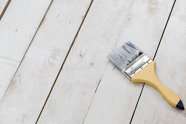 istock paint brush on the white wooden table background 477524958