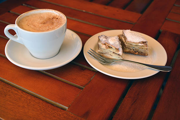 istock cup of black coffee with baklava 477525338