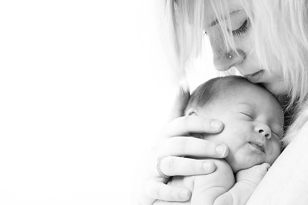istock Mothers face and her little child 477525417