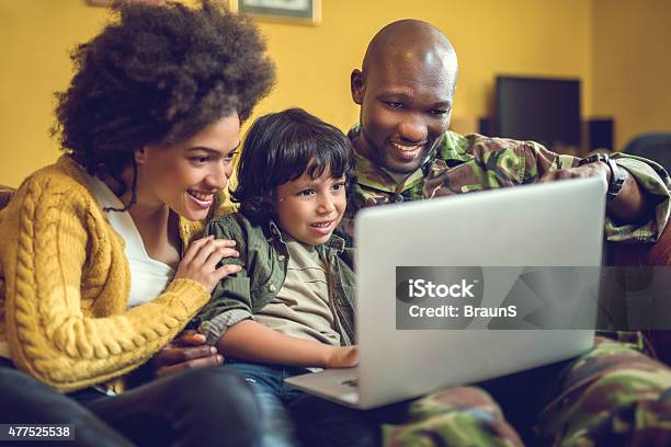 Happy African American Military Family Using Laptop At Home Stock Photo - Download Image Now